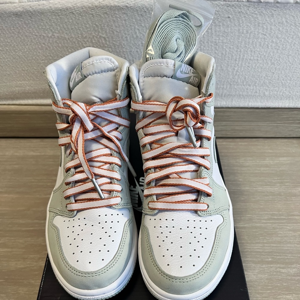Nike woman’s air Jordan 1 high OG in Seafoam White/Healing orange